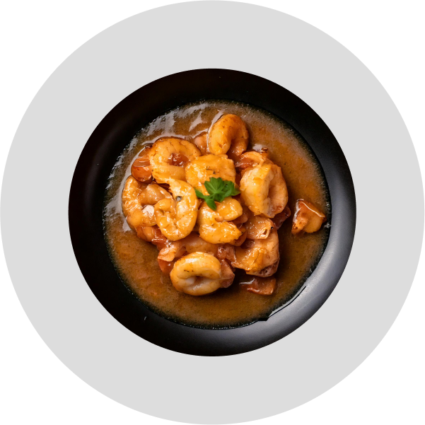 Savory shrimp dish prepared with Alcirelli Pure Vanilla Extract, showcasing gourmet cooking